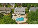 Aerial view showcasing a beautiful pool, spa, and patio in the backyard of this property at 10223 Willingham Rd, Huntersville, NC 28078