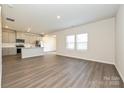 Bright open-concept living space showcases modern vinyl plank flooring and lots of natural light at 1342 31St St, Conover, NC 28613