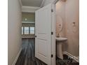 Modern powder room with sleek pedestal sink and neutral walls at 1350 31St St, Conover, NC 28613