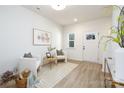 Welcoming entryway featuring a white front door, light wood floors, and stylish decor at 1604 Breezewood Dr, Charlotte, NC 28262
