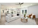 Spacious open-concept living room with kitchen view, comfortable seating and stylish furnishings at 1604 Breezewood Dr, Charlotte, NC 28262