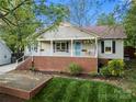 Inviting home featuring a classic front porch with flower boxes and manicured landscaping at 1631 Amanda Ln, Rock Hill, SC 29730