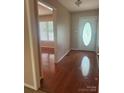 Elegant foyer with gleaming hardwood floors and a decorative glass front door at 165 Graceland Pl, Salisbury, NC 28146