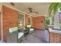Relaxing covered porch with brick accents and comfortable seating at 1804 Thomas Ave, Charlotte, NC 28205