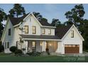 Beautiful two-story home with a covered porch, white siding, and a well-manicured lawn at 1807 Kennesaw Dr, Charlotte, NC 28216