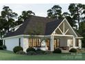 Expansive rear exterior with a covered patio and ample seating for entertaining or relaxing at 1807 Kennesaw Dr, Charlotte, NC 28216