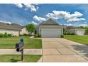 Beautiful single-story home featuring a spacious driveway, two-car garage, and well-maintained lawn at 23147 Whimbrel Cir, Fort Mill, SC 29707