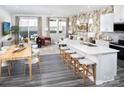 Open-concept kitchen and living area with stylish decor and access to outdoor patio at 2460 Hedgecliff Rd, Kannapolis, NC 28025