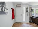 Light and airy entryway with a white door and small window on one side at 2784 Leadoff Rd, Lancaster, SC 29720