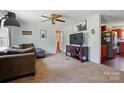 Living room featuring a large sectional sofa and a modern media center at 2784 Leadoff Rd, Lancaster, SC 29720