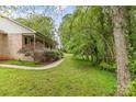 Spacious backyard featuring lush greenery, mature trees, and a peaceful, natural setting at 302 6Th Sw St, Conover, NC 28613