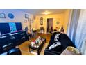 Cozy living room featuring hardwood floors, neutral walls, and ample natural light at 3232 Marlborough Rd, Charlotte, NC 28208