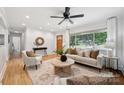 Inviting living room featuring hardwood floors, natural light, and contemporary decor at 4021 Paisley Pl, Charlotte, NC 28208