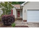 A charming front exterior shows updated siding, a manicured lawn, and a two-car garage at 508 Long Creek Pkwy, Charlotte, NC 28214