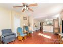 The living room has an open concept with hardwood flooring and a view to the kitchen at 124 10Th Sw St, Conover, NC 28613