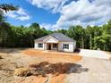 Charming one-story home with a well-maintained front yard and a driveway, set against a lush, green backdrop at 1247 Beltline Rd # 1, Chester, SC 29706