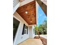 Inviting covered front porch with a stained wood ceiling, providing a warm welcome to this charming home at 1247 Beltline Rd # 1, Chester, SC 29706