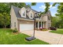 Lovely two-story home features a driveway basketball hoop and attached two car garage at 14849 Middlesborough Dr, Matthews, NC 28104