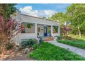 Attractive home exterior with a welcoming porch and vibrant landscaping at 1822 Hall Ave, Charlotte, NC 28205