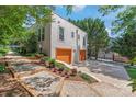 Spacious garage with multiple doors and ample parking space, complemented by tasteful landscaping at 1822 Hall Ave, Charlotte, NC 28205
