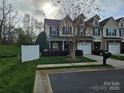 Inviting townhome featuring a well-manicured lawn, a single-car garage, and a cozy front porch at 2026 Talbot Ln, Hickory, NC 28602
