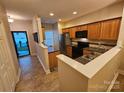 This kitchen features wood cabinets, tile backsplash, and stainless steel appliances at 2026 Talbot Ln, Hickory, NC 28602