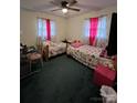 Shared bedroom with twin beds, matching curtains, and a desk area; great for siblings or guests at 204 Aspen Dr, Gastonia, NC 28052