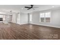 Bright and open living area with wood flooring, white trim, and large windows with plenty of natural light at 2075 Fordhill St, Rock Hill, SC 29732