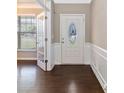 Elegant foyer with dark hardwood floors and a glass-paneled door to the study at 217 Hydrangea Dr, Clover, SC 29710