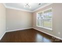 Bright study with hardwood floors, large window, and modern ceiling light fixture at 217 Hydrangea Dr, Clover, SC 29710