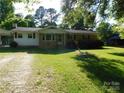 Charming single-story house with a well-maintained lawn and a carport on the side at 2826 Drew Dr, Lancaster, SC 29720