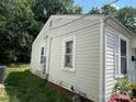 View of the side of the home with neutral siding, showcasing its design at 315 Broad Sw Dr, Concord, NC 28025
