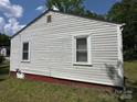 A simple yet functional side of the house with vinyl siding, showcasing its architecture at 315 Broad Sw Dr, Concord, NC 28025