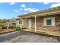 Brick home with a covered front porch and well-manicured landscaping at 505 2Nd Street Ne Pl # B2, Conover, NC 28613