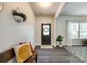 Inviting entryway featuring dark wood floors, a decorative wreath, and natural light at 5070 Saint Clair St, Fort Mill, SC 29715