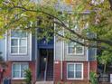 Building exterior showing the staircase to the entrance and manicured landscaping at 525 N Graham St, Charlotte, NC 28202