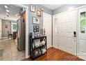 Spacious foyer with hardwood floors, decoratives and access to kitchen and living area at 6736 Raeburn Ln, Charlotte, NC 28227
