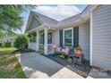 Inviting front exterior featuring a cozy bench, decorative pillows and seasonal decor at 744 Chipmeadow Ln, York, SC 29745