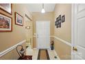 Inviting entryway with neutral walls, tiled flooring, and decorative wall art at 118 Winborne Dr, Mooresville, NC 28115