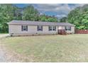 Inviting single-story home with a front lawn and dark shuttered windows, blending simplicity with comfort at 119 Marietta Rd, Mooresville, NC 28117