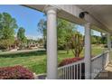 Inviting porch with white columns overlooking a meticulously maintained front yard at 136 Wood Duck Loop, Mooresville, NC 28117