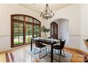 Bright dining room with large windows, wood floors, and a stylish chandelier at 277 Tradition Dr, Mount Gilead, NC 27306