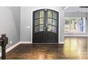 Entryway featuring double doors, wood floors and gray walls with a staircase visible in the background at 2817 Lakefront Dr, Belmont, NC 28012