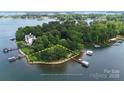 Beautiful aerial view of waterfront property with mature trees at 2818 Cherry Ln, Denver, NC 28037