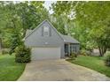 Well-maintained home with a two-car garage and inviting curb appeal and well-manicured lawn at 433 Linsbury Ct, Gastonia, NC 28056