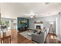 Cozy living room with hardwood floors, fireplace, and an open floor plan at 540 Garrison Sw Ct, Concord, NC 28025