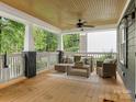 Relaxing outdoor porch area, furnished with comfortable seating, perfect for enjoying the surrounding view at 716 Ellsworth Rd, Charlotte, NC 28211
