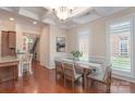 Dining room with coffered ceilings, hardwood floors, and natural light at 7722 Springs Village Ln # 40, Charlotte, NC 28226