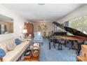Bright living room with a grand piano and classic decor at 812 Clinton Ave, Lancaster, SC 29720