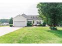 Charming one story home with well maintained lawn and landscaped garden beds at 135 Meadow Lake Dr, Salisbury, NC 28146